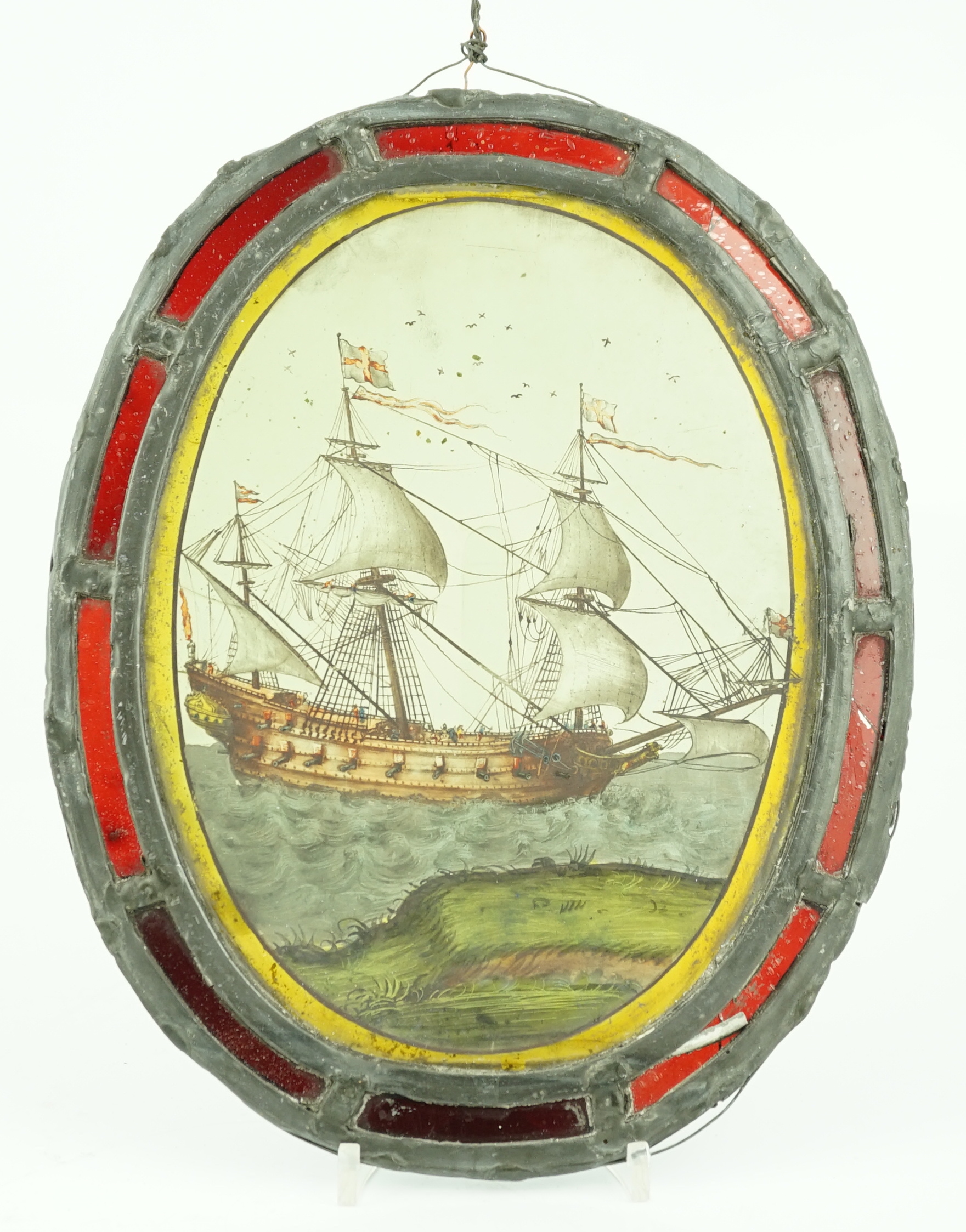 An early 18th century stained glass panel, overall 30 x 24cm